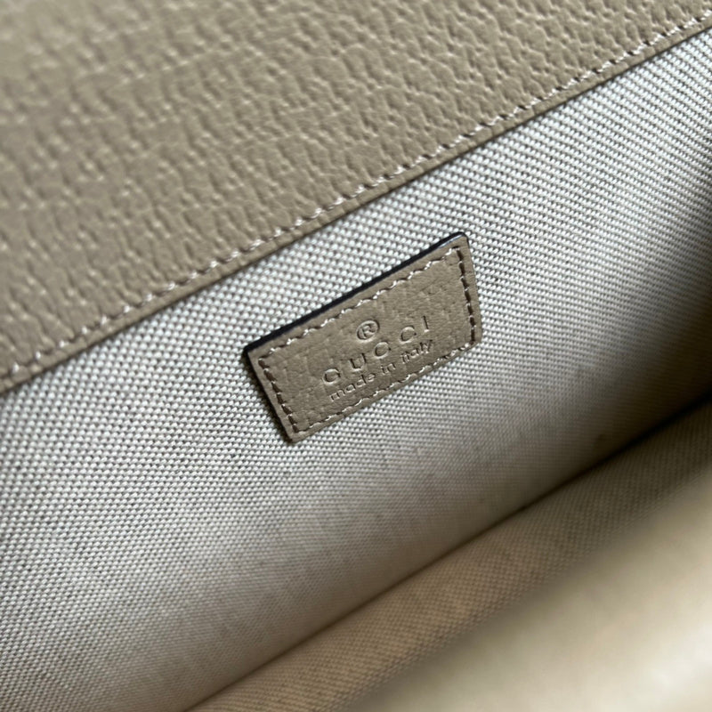 Side profile of polished classic women's handbag – women's designer-style accessory