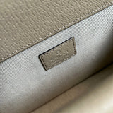 Side profile of polished classic women's handbag – women's designer-style accessory