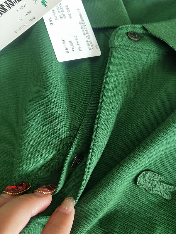 Close-up detail shot of Lacoste luxury clothing with signature branding