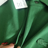 Close-up detail shot of Lacoste luxury clothing with signature branding