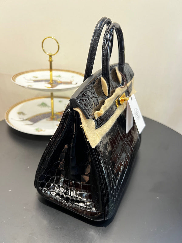 Side view of classic structured handbag