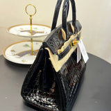 Side view of classic structured handbag
