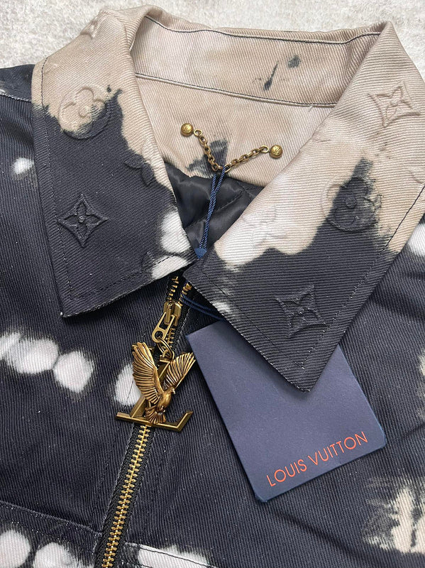 Close-up detail shot of Louis Vuitton luxury clothing with label-forward styling