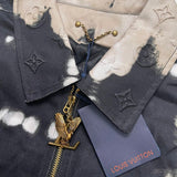 Close-up detail shot of Louis Vuitton luxury clothing with label-forward styling