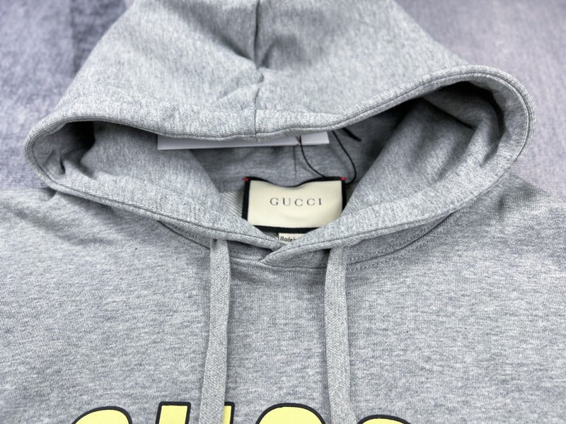 Close-up detail shot of Gucci luxury clothing with monogram-inspired silhouette