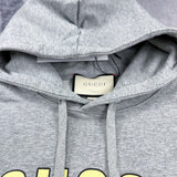 Close-up detail shot of Gucci luxury clothing with monogram-inspired silhouette