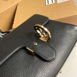 Styled lifestyle shot of everyday-luxe sleek women's handbag – women's statement bag