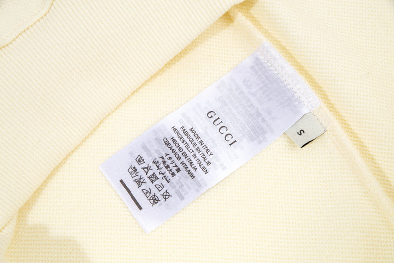 Close-up detail shot of Gucci luxury clothing with contemporary cut
