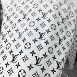 Flat lay presentation of Louis Vuitton luxury clothing with everyday silhouette