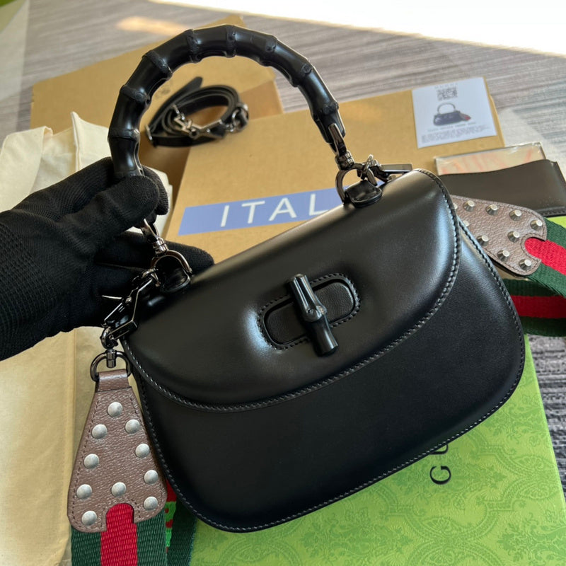 Handle and strap detail of everyday-luxe modern women's handbag – women's statement bag