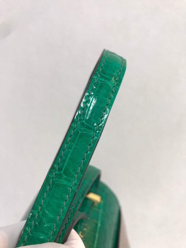 Side view of poised structured handbag
