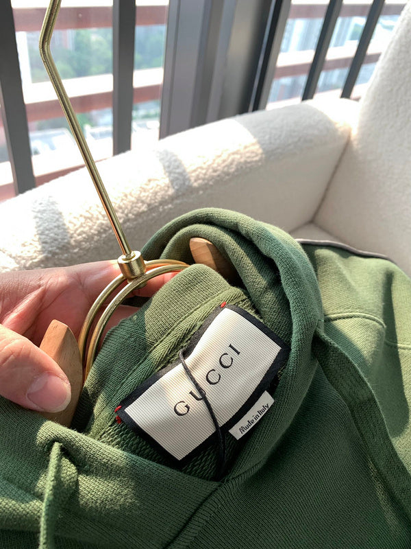 Back view of Gucci luxury clothing with logo-detail design