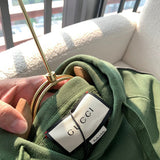 Back view of Gucci luxury clothing with logo-detail design