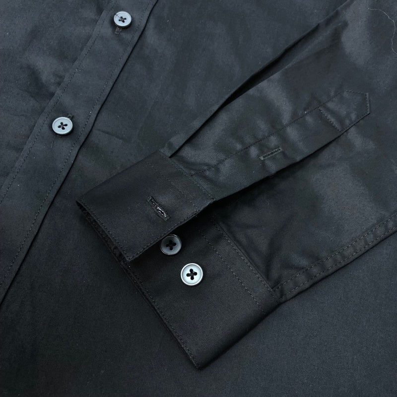 Flat lay presentation of Louis Vuitton luxury clothing with monogram-inspired silhouette