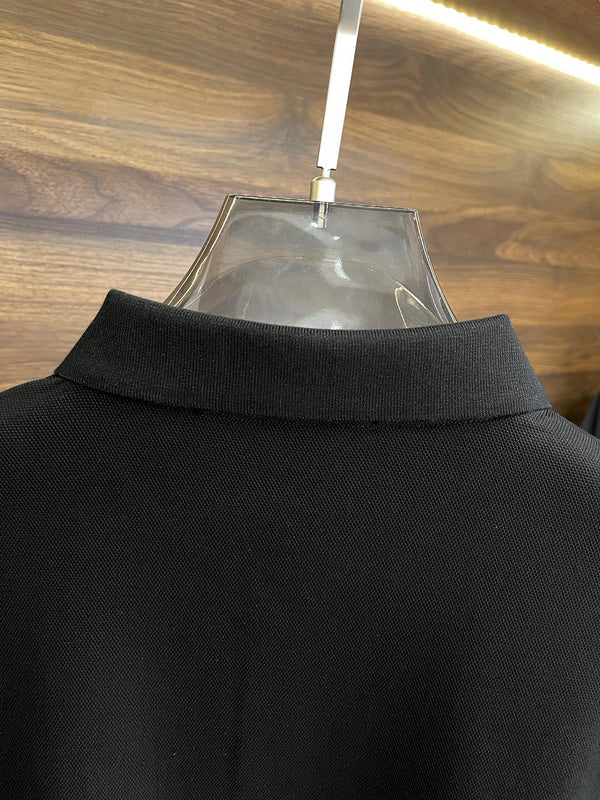 Flat lay presentation of Louis Vuitton luxury clothing with label-forward styling