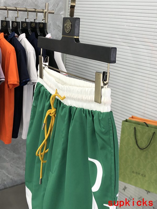 Flat lay presentation of Rhude luxury clothing with label-forward styling