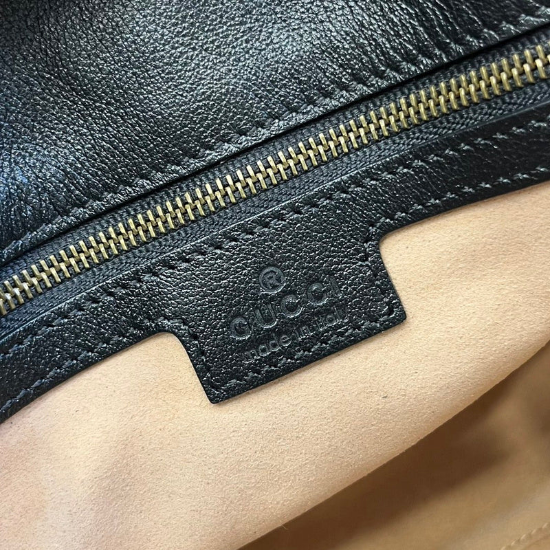 Side profile of statement premium women's handbag – women's luxury handbag