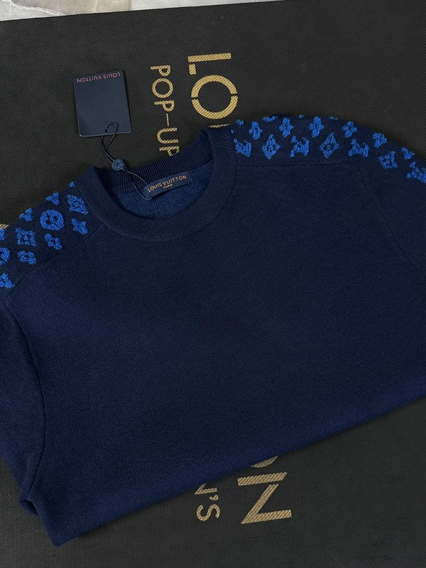 Close-up detail shot of Louis Vuitton luxury clothing with contemporary cut