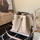 Side profile of elevated sleek women's handbag – women's statement bag