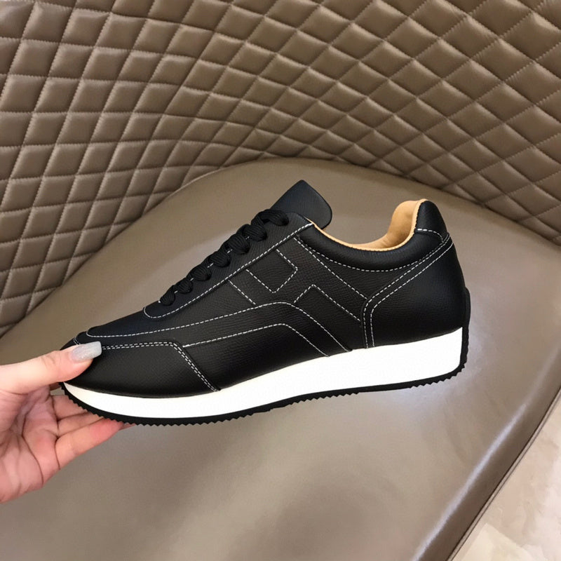 Hermes shoes Style 158 - close-up of statement logo accent