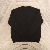 Close-up detail shot of Louis Vuitton luxury clothing with logo-detail design