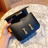  minimalist top-handle bag styled with outfit