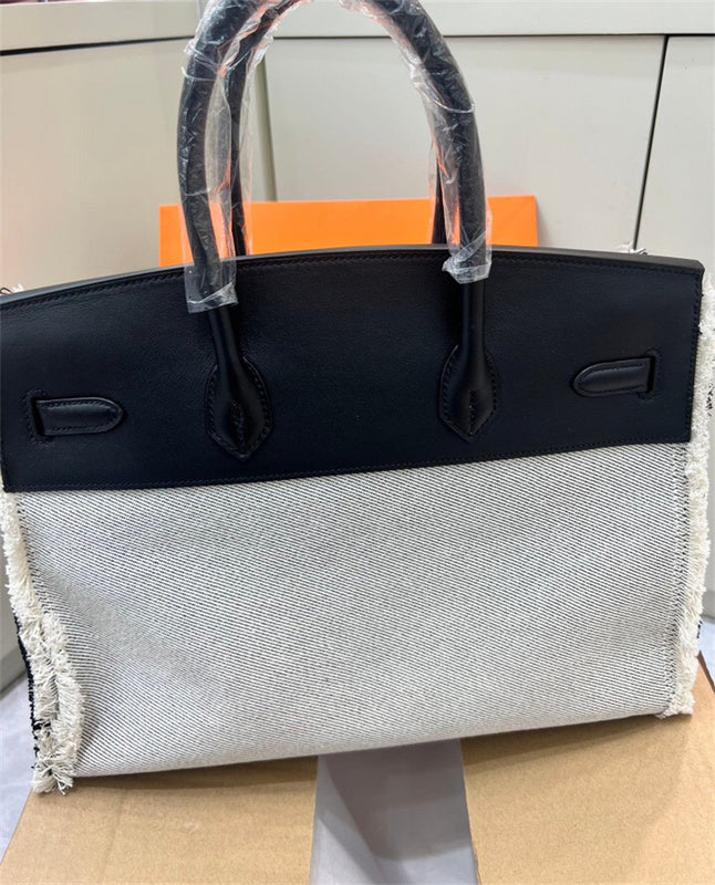Side view of fluid structured handbag