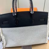 Side view of fluid structured handbag