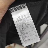 Back view of Lacoste luxury clothing with signature branding