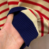 Side profile of Gucci luxury clothing with label-forward styling