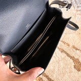 Side view of elegant structured handbag