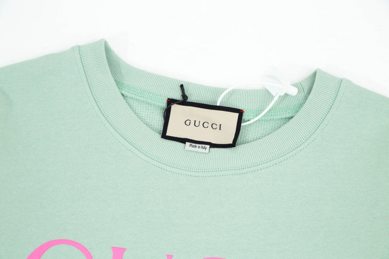 Close-up detail shot of Gucci luxury clothing with contemporary cut