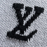 Full styled look of Louis Vuitton luxury clothing with signature branding