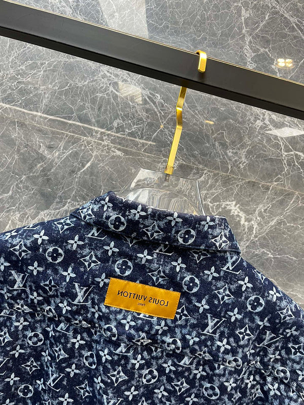 Close-up detail shot of Louis Vuitton luxury clothing with logo-detail design