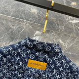 Close-up detail shot of Louis Vuitton luxury clothing with logo-detail design