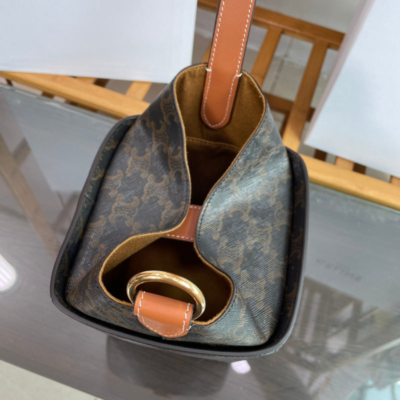 Side profile of elevated signature women's handbag – women's luxury accessory
