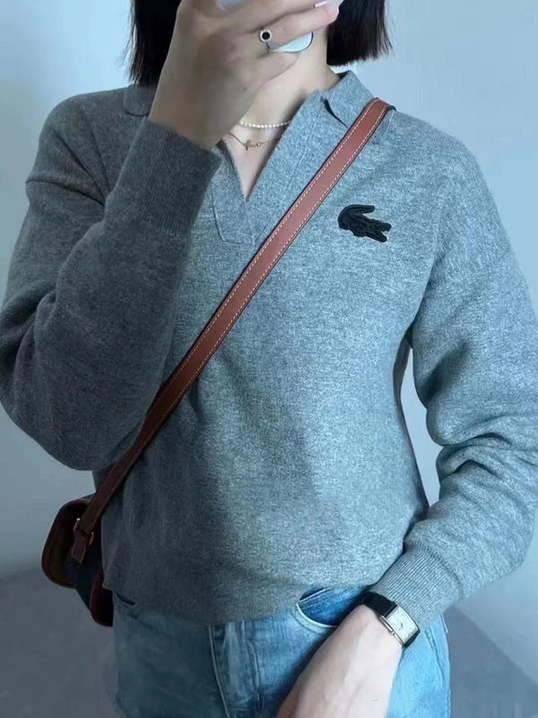 Close-up detail shot of Lacoste luxury clothing with monogram-inspired silhouette