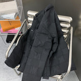 Close-up detail shot of Louis Vuitton luxury clothing with label-forward styling