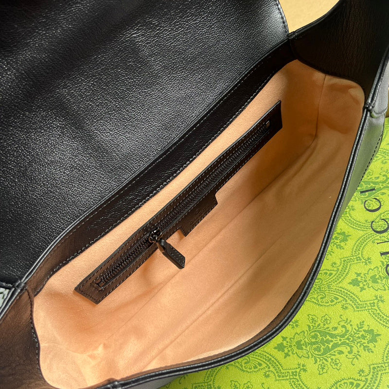 Styled lifestyle shot of signature classic women's handbag – women's luxury accessory
