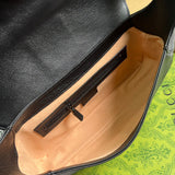 Styled lifestyle shot of signature classic women's handbag – women's luxury accessory