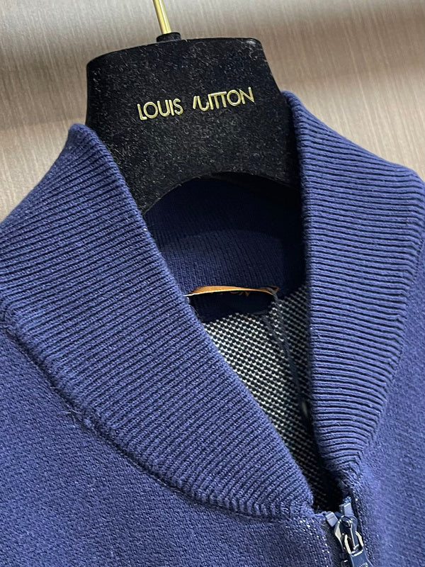 Close-up detail shot of Louis Vuitton luxury clothing with monogram-inspired silhouette
