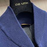 Close-up detail shot of Louis Vuitton luxury clothing with monogram-inspired silhouette