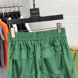 Front view of Rhude luxury clothing with monogram-inspired silhouette