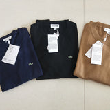 Back view of Lacoste luxury clothing with monogram-inspired silhouette