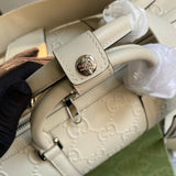 Handle and strap detail of polished everyday-luxe women's handbag – women's statement bag