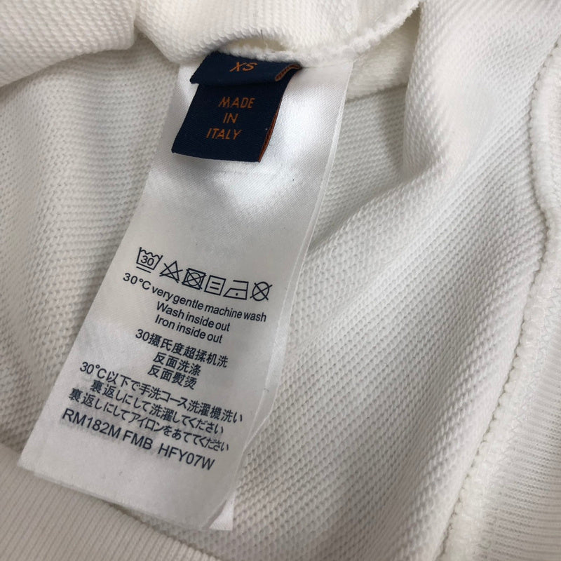 Side profile of Louis Vuitton luxury clothing with tailored silhouette