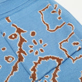 Close-up detail shot of Rhude luxury clothing with label-forward styling