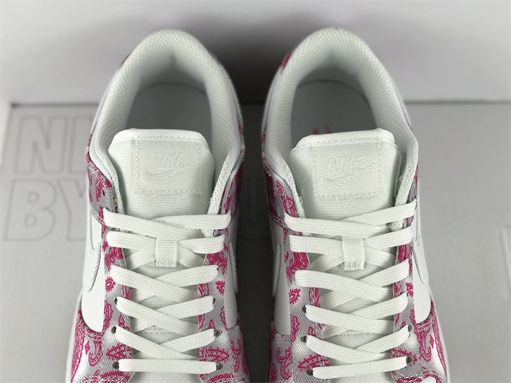 Side profile of Nike soft grey sneakers padded collar comfort