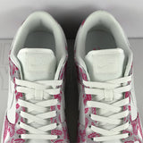 Side profile of Nike soft grey sneakers padded collar comfort