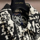 Close-up detail shot of Louis Vuitton luxury clothing with logo-detail design